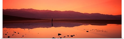 Reflection of mountains in water, Badwater, Death Valley, California,