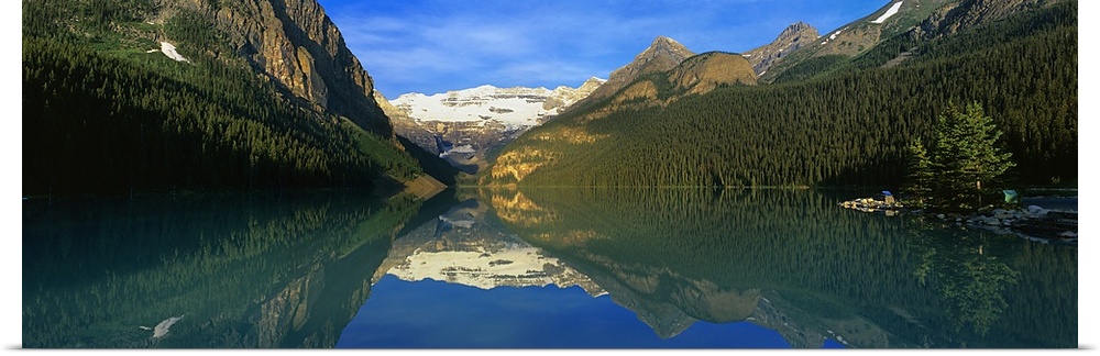 Reflection of mountains in water, Lake Louise, Banff National Park, Alberta, Canada