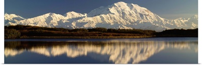 Reflection of snow covered Mt McKinley in water, Denali National Park, Alaska