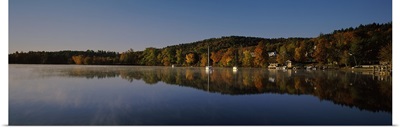 Reflection of trees in a lake, Lake Winnipesaukee, Center Harbor, Belknap County, New Hampshire
