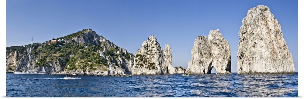 Rock formations in the sea Faraglioni Capri Naples Campania Italy
