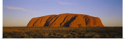 Rock formations on a landscape, Ayers Rock, Uluru-Kata Tjuta National Park, Northern Territory, Australia
