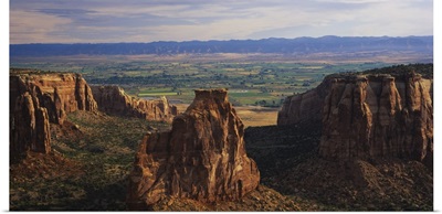 Rock formations on a landscape, Grand Junction, Grand Valley, Colorado National Monument, Colorado
