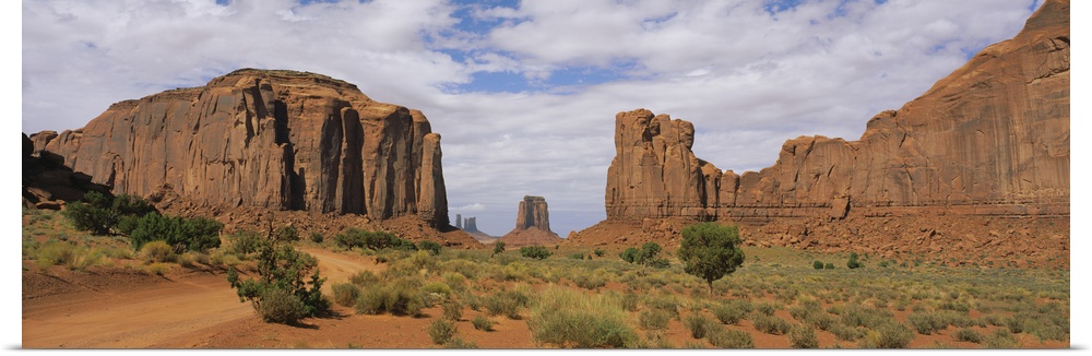 Rock formations on an arid landscape, Monument Valley Tribal Park, Arizona