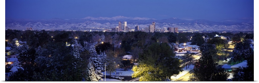 Panoramic photo on canvas of the cityscape of Denver with snowy mountains in the distance.