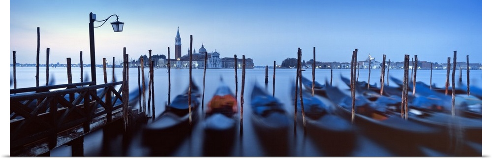 Row of gondolas moored near a jetty, Venice, Italy