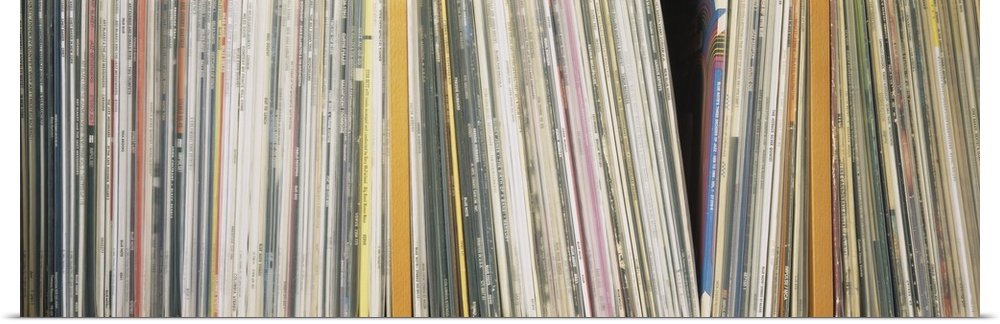 Panoramic photograph shows an abundance of vinyl albums sitting on a shelf.  Notable artists include Dizzy Gillespie, Mile...