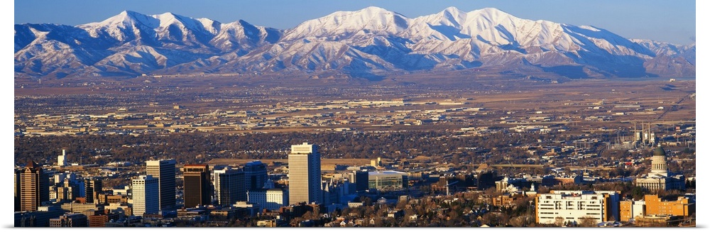 This panorama features the contrasting terrain of Salt Lake City, Utah and mountain peaks.