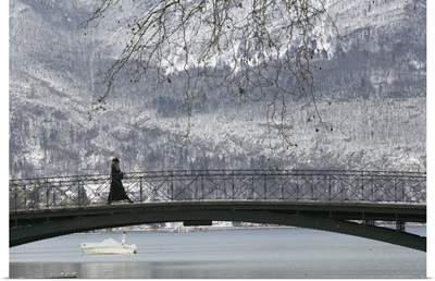 Side profile of a person walking on a bridge, Lake Annecy, French Alps, France