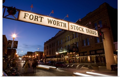 Signboard over a road at dusk, Fort Worth Stockyards, Fort Worth, Texas