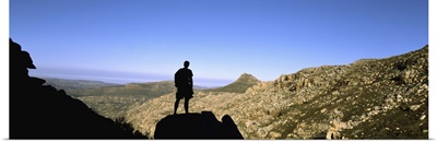 Silhouette of a hiker standing on a rock, Cederberg Mountains, South Africa
