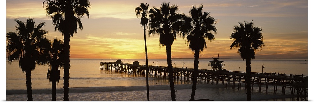 Panoramic image of the San Clemente Pier at sunset in Los Angeles, California.