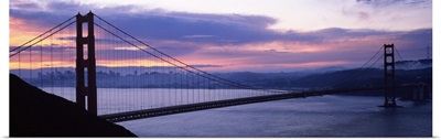 Silhouette of a suspension bridge at dusk, Golden Gate Bridge, San Francisco, California,