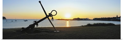 Silhouette of an anchor on the beach at sunrise, North Berwick, East Lothian, Scotland