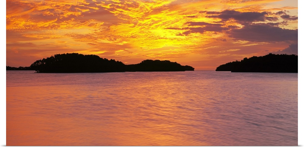 Large canvas photo of a vibrant sunset reflected in calm waters.