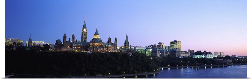 Silhouette of parliament building along a lake, Ottawa, Ontario, Canada