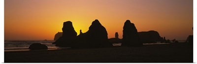 Silhouette of rock formations at sunset, Pacific Ocean, Bandon State Natural Area, Bandon, Oregon