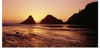 Silhouette of rocks at sunset, Heceta Head Lighthouse, Devils Elbow State Park, Oregon