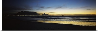 Silhouette of Table Mountain at sunset, Table Bay, Bloubergstrand, Cape Winelands, Western Cape Province, South Africa