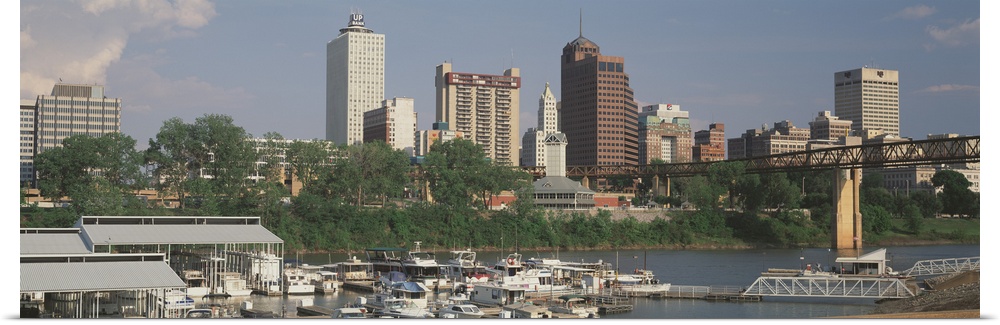 A panoramic view of the Memphis, Tennessee skyline, including boats on the river.
