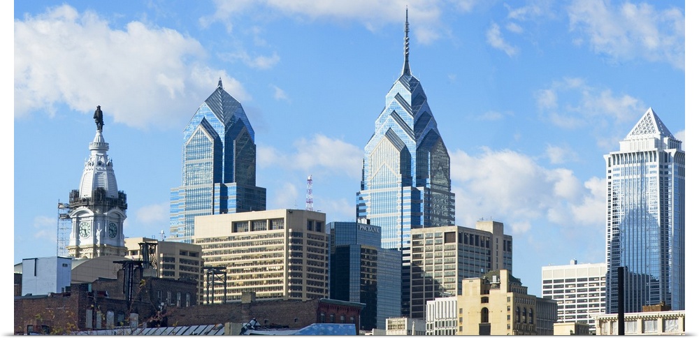 An urban landscape photograph of the city skyline taken from ground level.