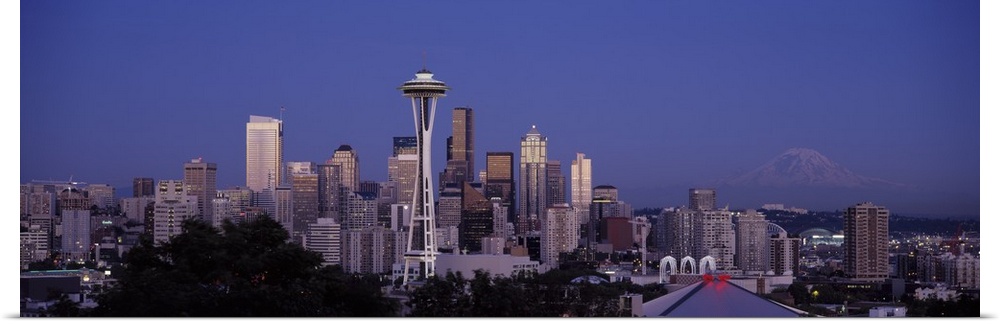 A panoramic view of the Seattle skyline with the space needle focused in the middle.