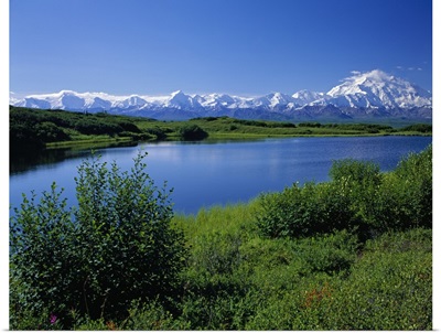 Snow-covered Mount McKinley, mountain lake, blue sky, Denali National Park, Alaska