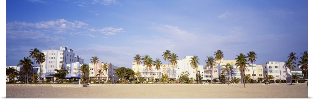 Panoramic wall art of hotels lining a beach in Florida.