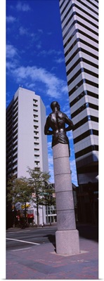 Statue in front of buildings in a city, Charlotte, North Carolina
