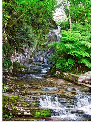 Stream flowing through rocks, Villa Pliniana, Torno, Lake Como, Lombardy, Italy