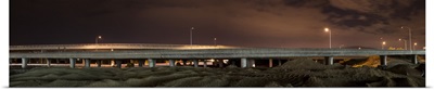 Street lights lit up at night on an overpass, California