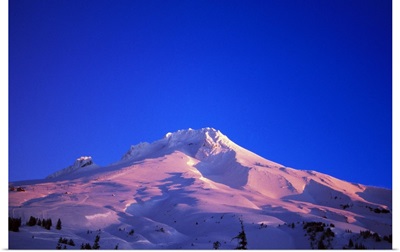 Sunrise light on snowy Mount Hood, clear blue sky, Oregon, united states,
