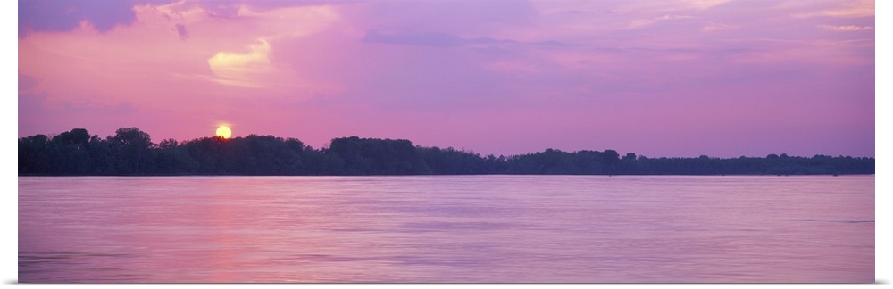 A pink-hued sunset panorama of the Mississippi riverbanks in Memphis, Tennessee.