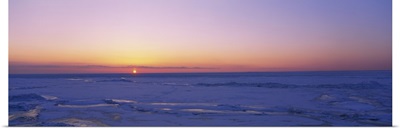 Sunset over a frozen lake, Lake Erie, New York State