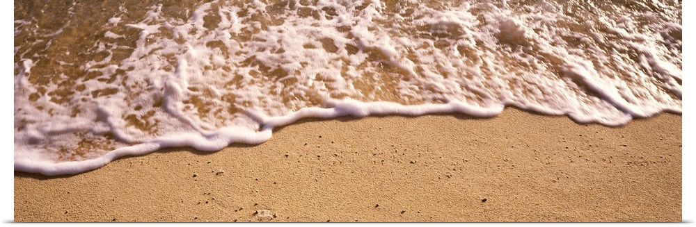 Panoramic photograph of sea spray on shoreline.