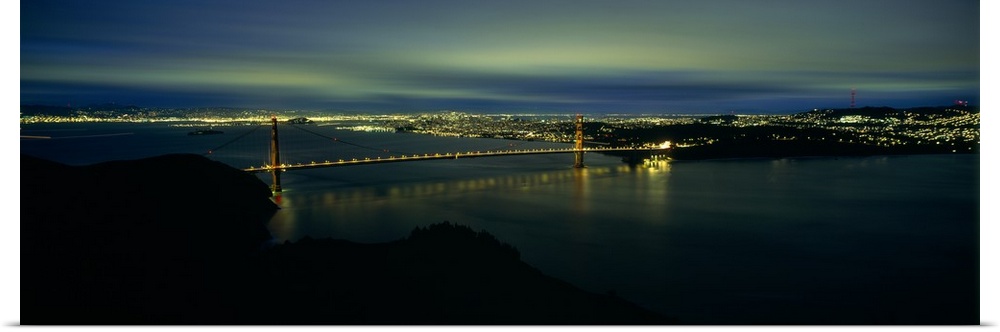 Suspension bridge lit up at dusk, Golden Gate Bridge, San Francisco Bay, San Francisco, California,