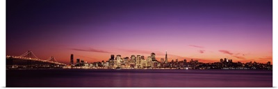 Suspension bridge with city skyline at dusk, Bay Bridge, San Francisco Bay, San Francisco, California,