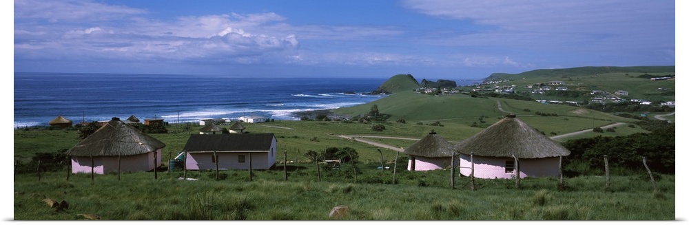 Thatched roofed Rondawel huts on a landscape, Hole in the Wall, Coffee Bay, Transkei, Wild Coast, Eastern Cape Province, R...