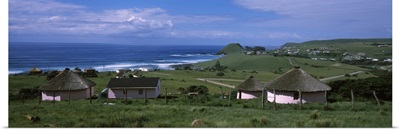 Thatched roofed Rondawel huts on a landscape, Hole in the Wall, Coffee Bay, Transkei, Wild Coast, Eastern Cape Province, Republic of South Africa