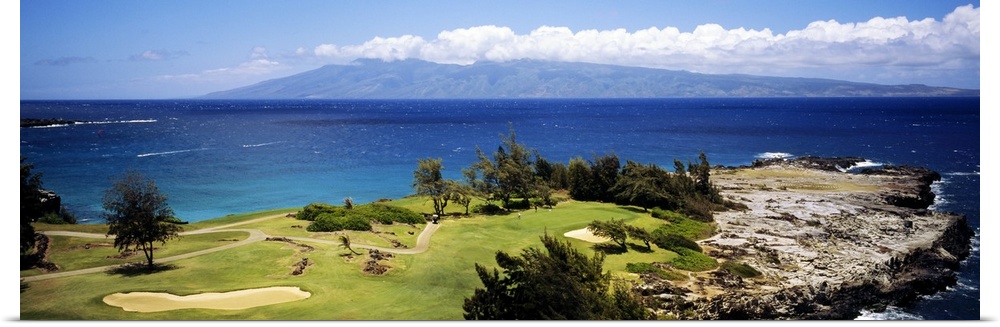 Big horizontal panoramic photograph of a golf course by the ocean in Maui, Hawaii (HI).