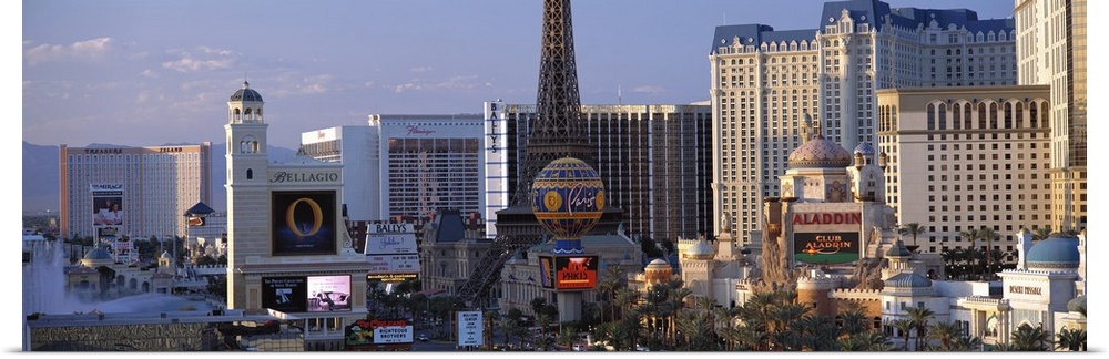 Panoramic photograph on a large canvas of the Las Vegas strip during the day, including the Bellagio, Paris and Aladdin's.