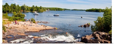 Tourists enjoying at lakeside, Muskoka, Ontario, Canada