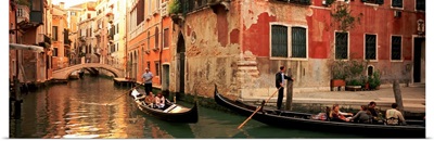 Tourists in a gondola, Venice, Italy