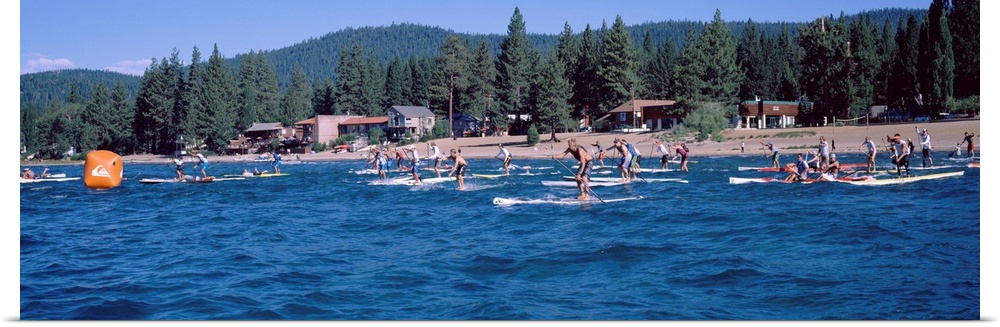 Tourists paddle boarding in a lake, Lake Tahoe, California, USA
