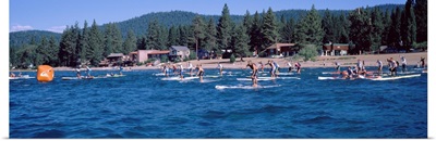 Tourists paddle boarding in Lake Tahoe, California