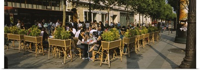 Tourists sitting at a sidewalk cafe, Avenue Des Champs-Elysees, Paris, France