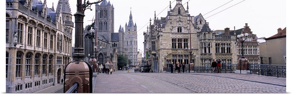 Tourists walking in front of a church, St. Nicolas Church, Ghent, Belgium