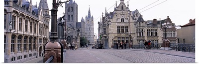 Tourists walking in front of a church, St. Nicolas Church, Ghent, Belgium