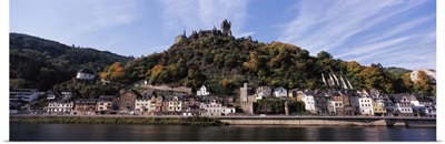 Town at the riverside with Reichsburg Castle on hill, Rhineland-Palatinate, Germany