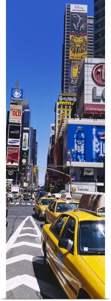 Vertical panoramic photograph taken of a busy street in Times Square.